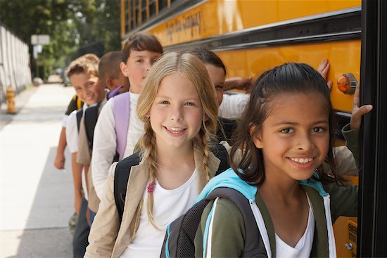 children boarding school bus