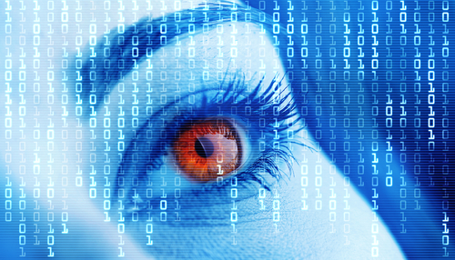 imagie of woman's eye in red staring at scrolling data bit images