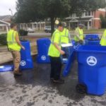 crews delivering recycling bins
