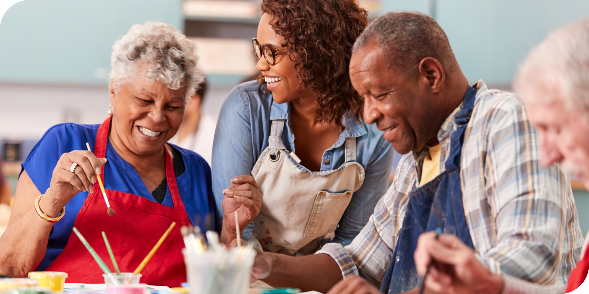 instructor and older adults in art class