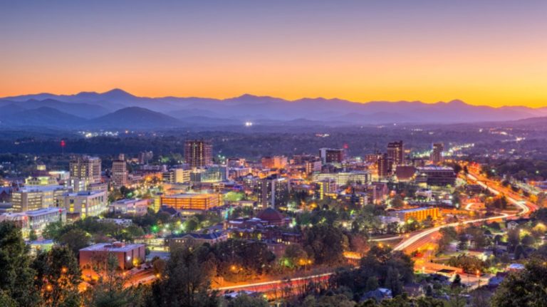 asheville city with purple sunset