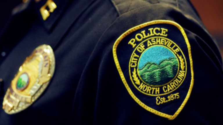 city of asheville police badge on shirt
