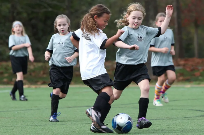 girls playing soccer