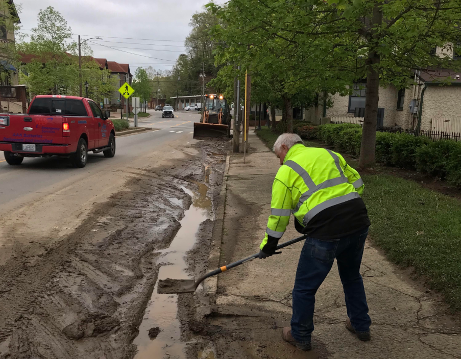 post flood road cleaning continues in Biltmore Village