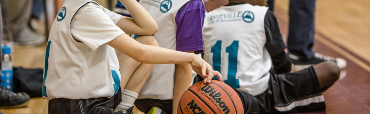 city of asheville baketball team waiting to play