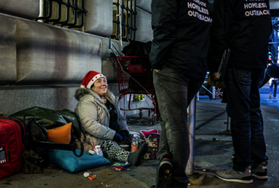 Photo of homeless woman with outreach coordinator