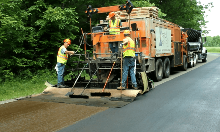 microsurfacing truck laying product on road