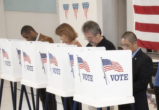 Photo of 4 people voting