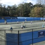 people playing on the courts at aston park tennis center