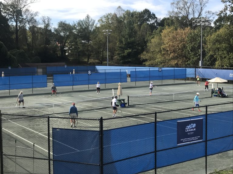 people playing on the courts at aston park tennis center