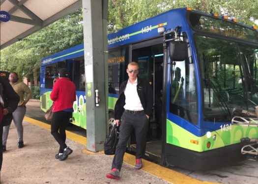 ART bus rider walking off bus