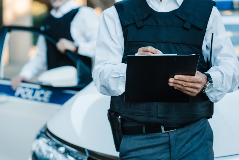 photo illustration of officers wearing bulletproof vests