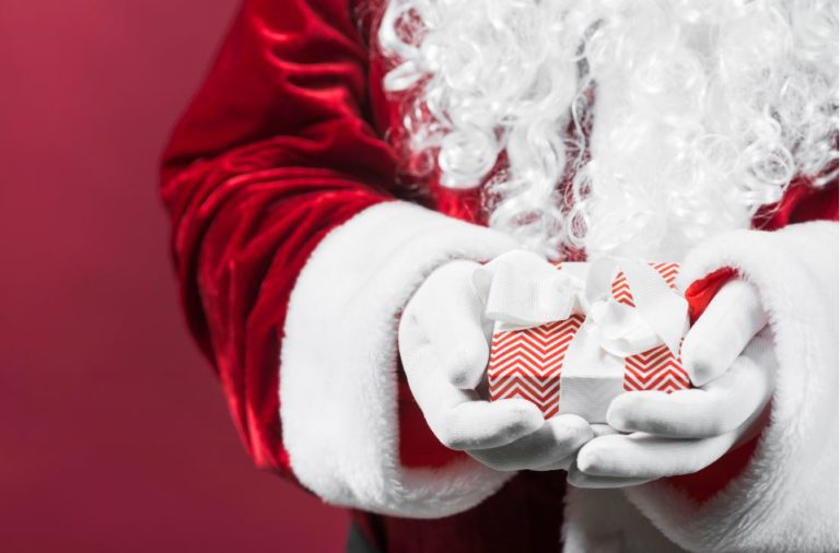 Santa hands with present