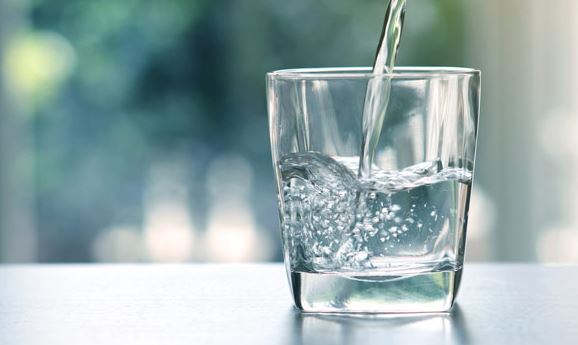 photo of water being poured into a glass