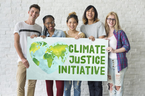 people holding sign that says 'climate justice initiative'