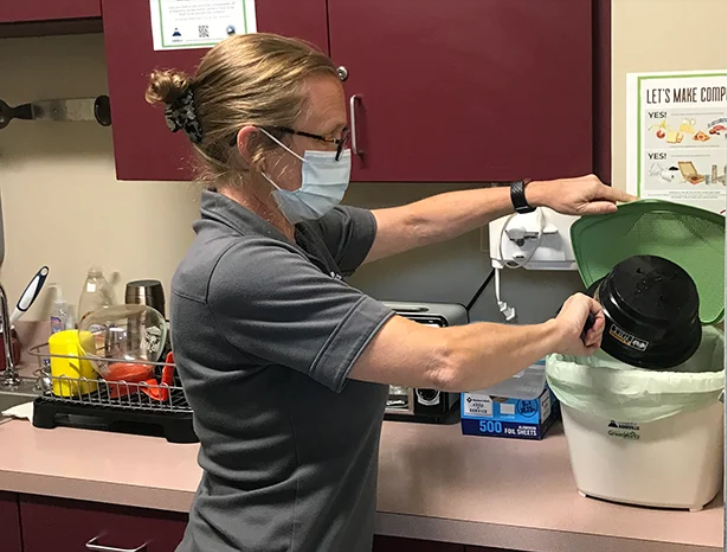 Asheville woman making compost