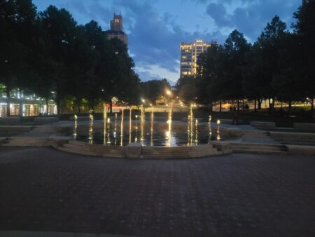Splasheville splash pad in downtown Asheville's Pack Square Park at night