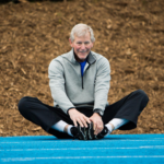 man stretching in seated position