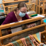 adult woman at weaving loom