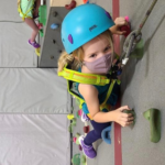 child on climbing wall