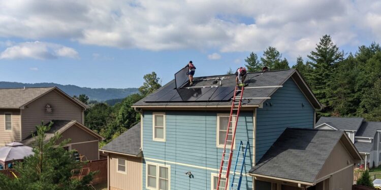 installing solar panels on residential roof