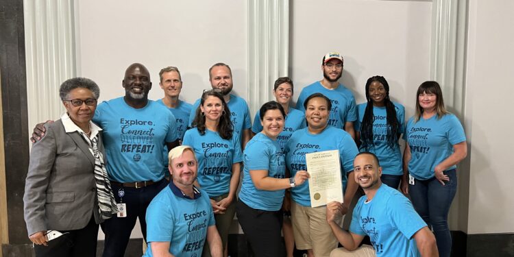 parks and rec department staff recognized in proclamation pose for group photo