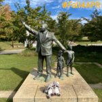 stuffed raccoons at the foot of MLK statue