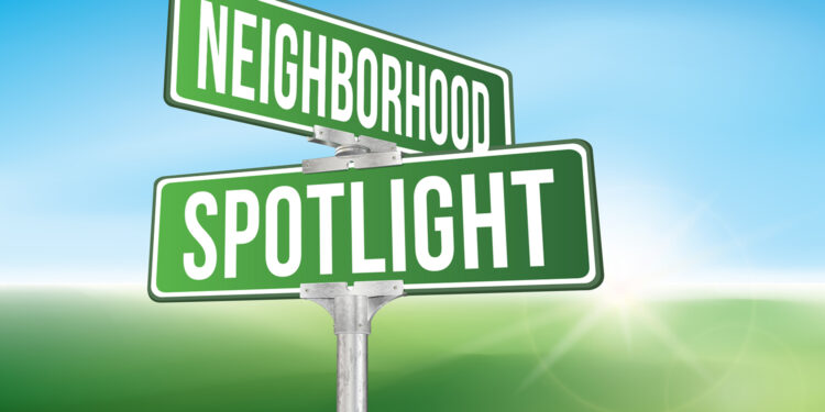 street sign that says neighborhood spotlight