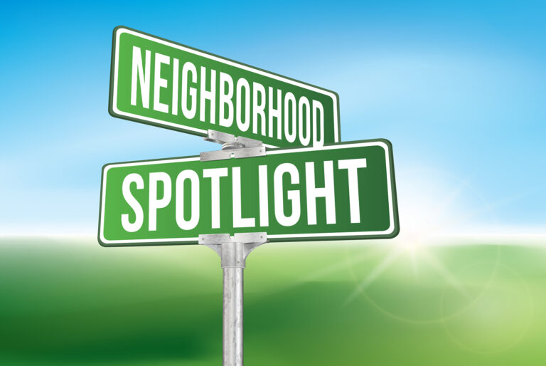 street sign that says neighborhood spotlight