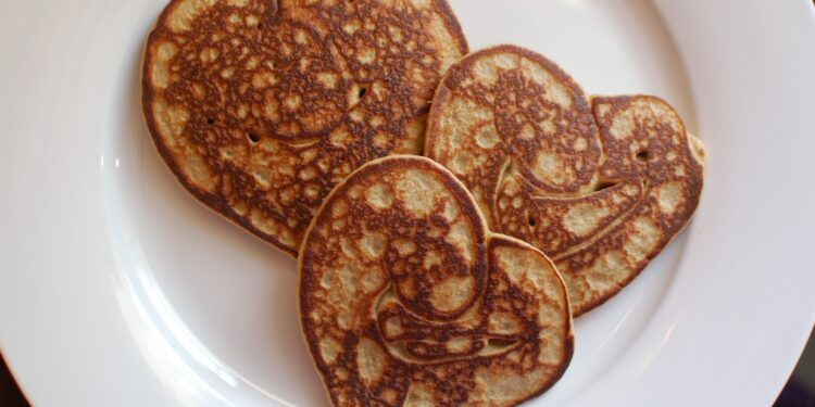 heart shaped pancakes on white plate