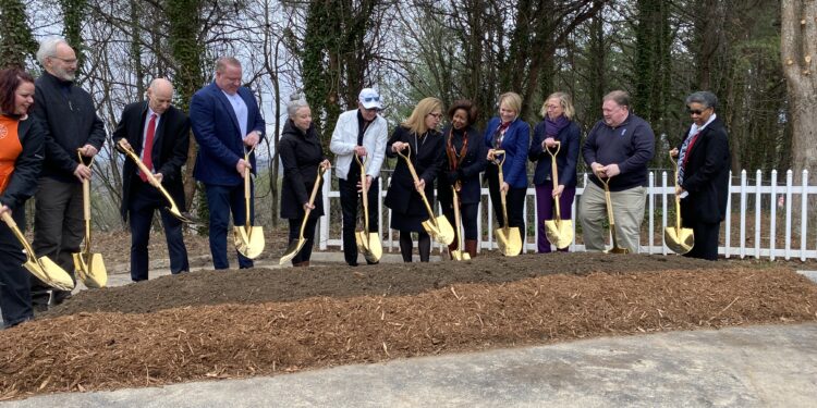 city staff join representatives from Step UP Shangri-La and home depot to breakground