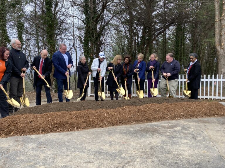 city staff join representatives from Step UP Shangri-La and home depot to breakground