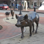 bronze pigs and turkeys in park