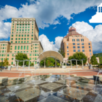 courthouse, city hall, and stage in park with splashpad in the foreground