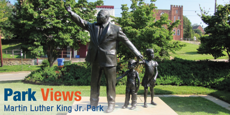 statue of martin luther king jr with two children