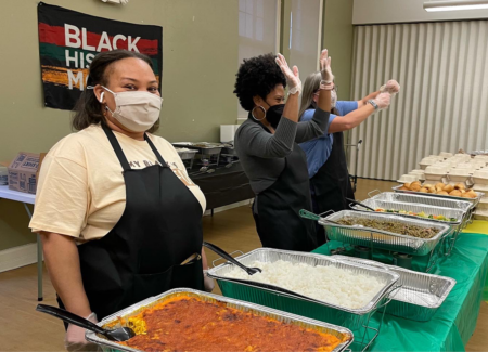 women service food at banquet table