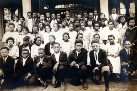 young black men and women in high school group picture