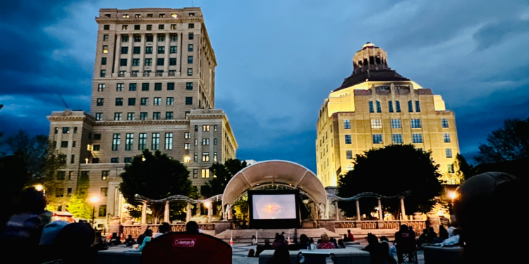 pack square park with screen on stage