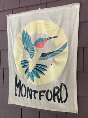 flag with hummingbird logo and word montford on it