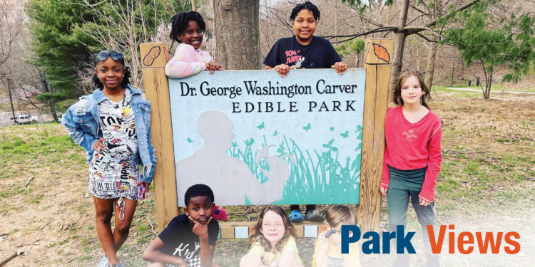 young children around park sign titled Dr. George Washington Carver Edible Park