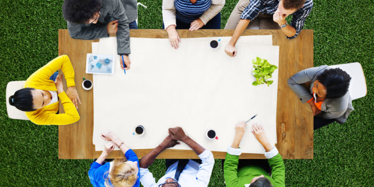 people meeting at a table view from the top