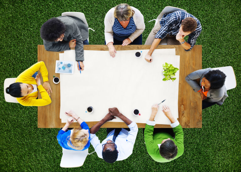 people meeting at a table view from the top