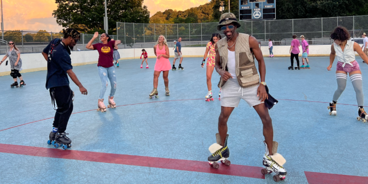 several people roller skating outside