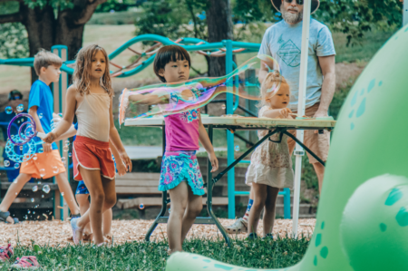 kids playing with soap bubbles