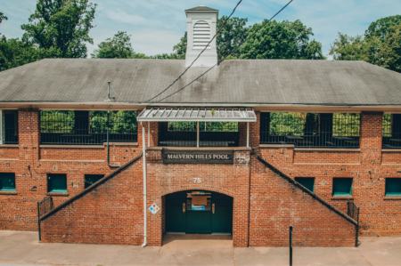 entrance to malvern hills pool, a two story brick structure