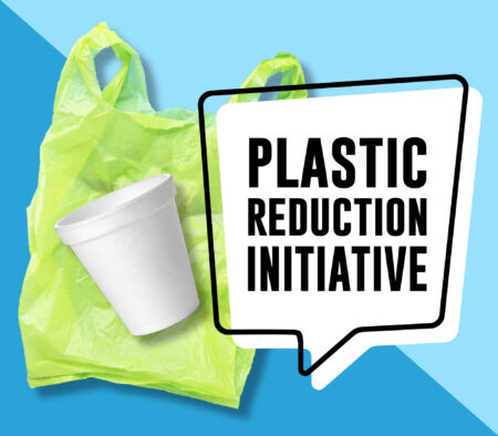 white styrofoam cup and green plastic bag with word plastic reduction initiative