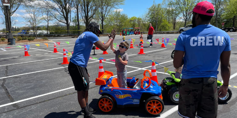 aundreas hill giving high 5 to young boy