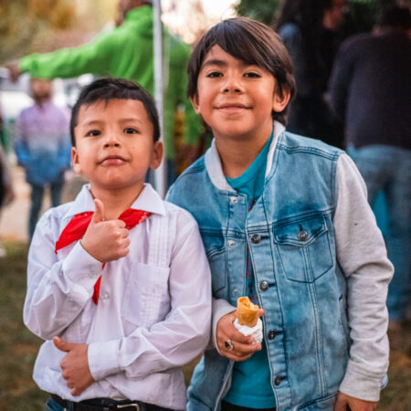 two young hispanic boy wearing white shirt and denim jacket