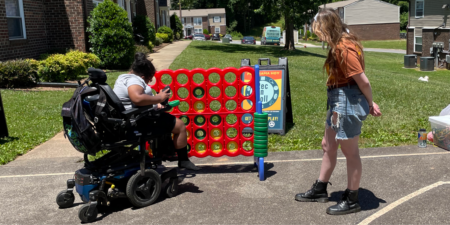 girl in wheelchair playing lifesize connect 4