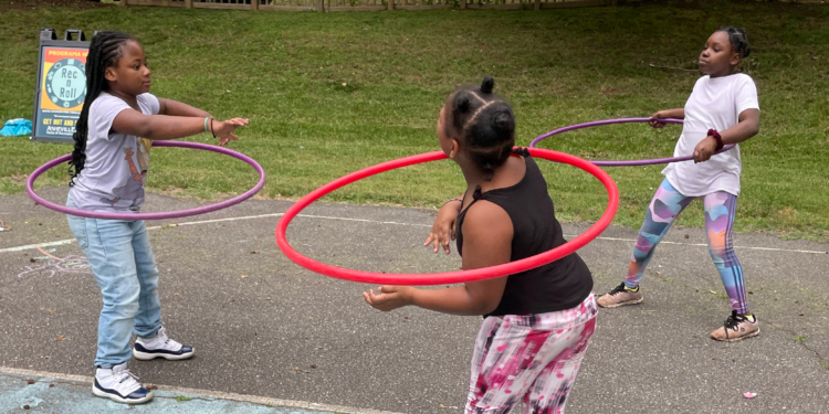 girls playing with hula hoops
